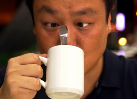 spoon holding mug