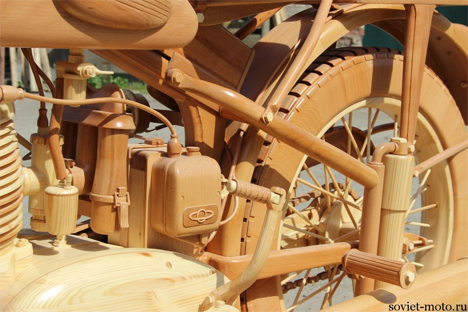 intricate carved wooden motorcycle