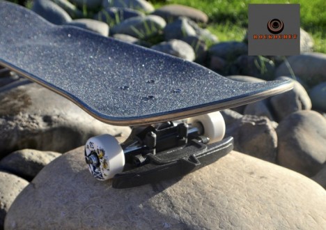 rock deflecting skateboard attachment